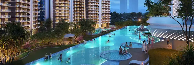 Rooftop infinity pool lit at night at Smartworld The Edition